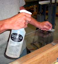 Mr. Mogford appling the product 83-825 Silicon and Adhesive Remover